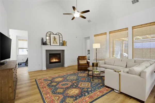 a living room with furniture fireplace and window
