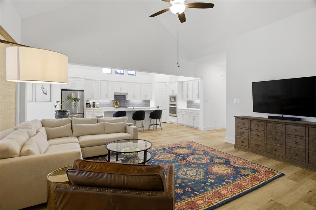 6033 Strada Cove Fort Worth, TX 76123 - Photo 8 of 35 a living room with furniture and a flat screen tv