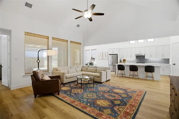 a living room with furniture and a rug