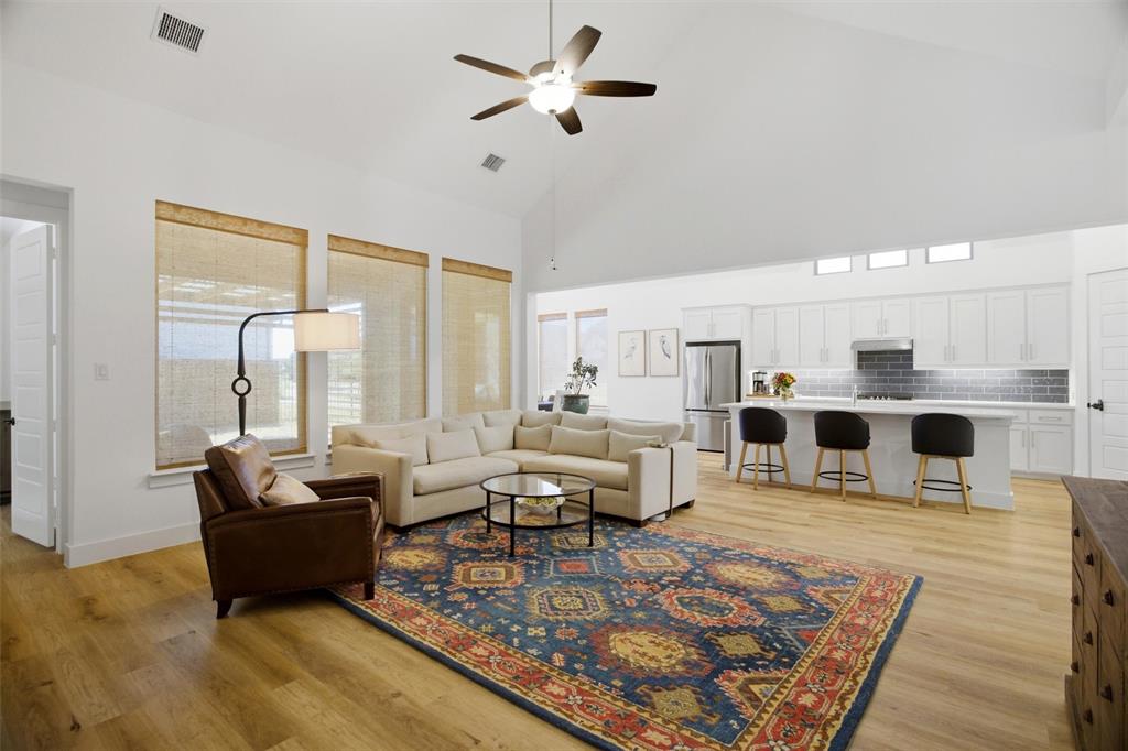 6033 Strada Cove Fort Worth, TX 76123 - Photo 9 of 35 a living room with furniture and a rug
