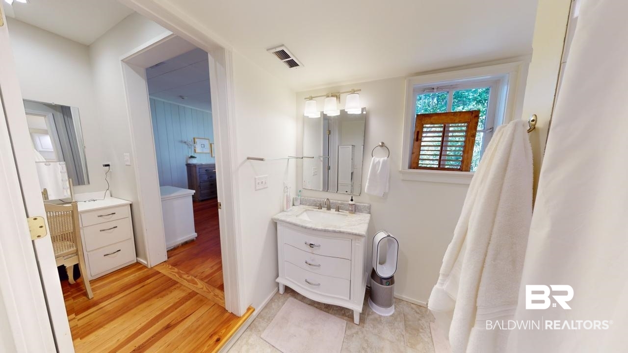 4358 Stein Street Mobile, AL 36608 - Photo 13 of 29 Bathroom featuring vanity and wood-type flooring