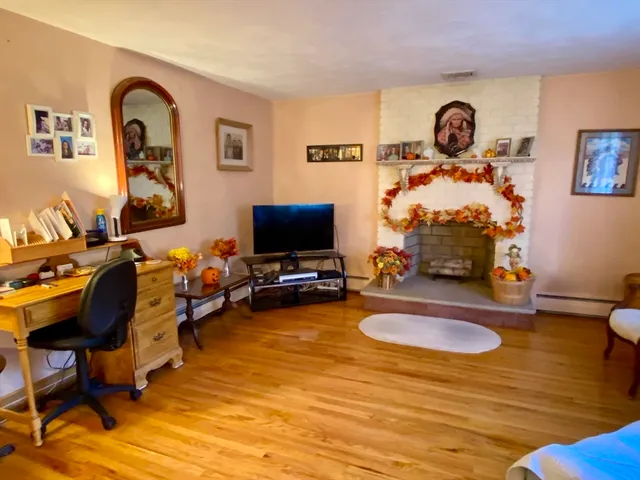 a view of a dining room and livingroom with furniture