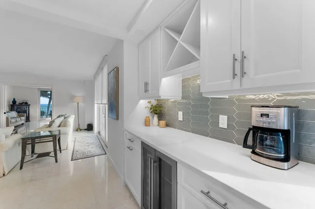 a kitchen with furniture and a fireplace