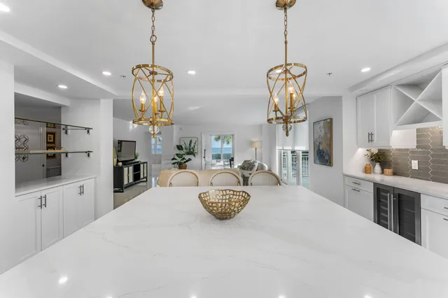 a kitchen with counter top space appliances and cabinets