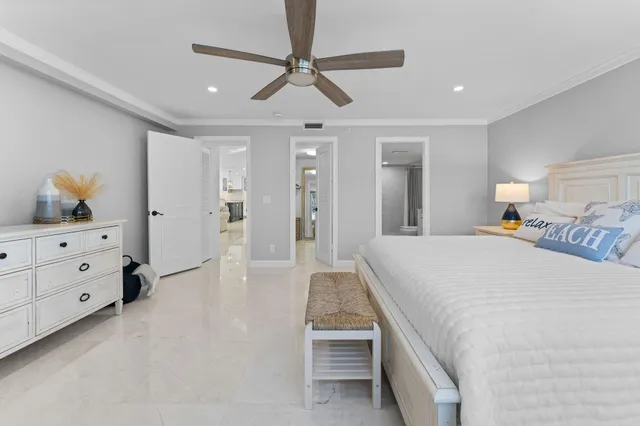 a large white bedroom with kitchen