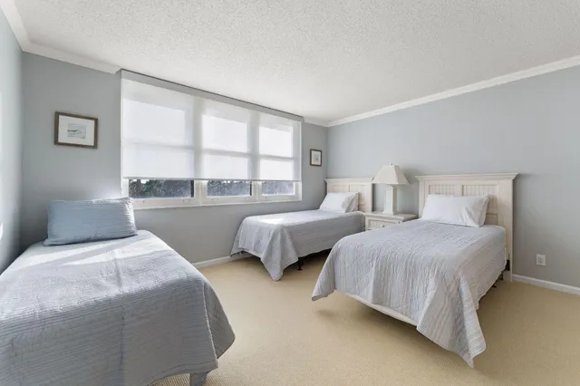 a bedroom with bed and window