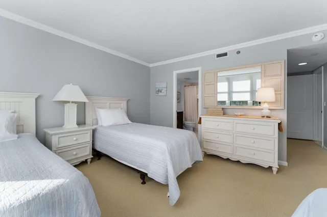 a bathroom with a granite countertop toilet a sink and a mirror