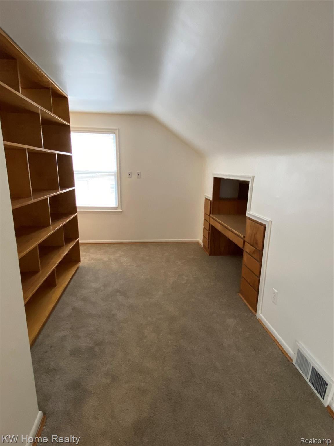 11304 Inkster Road Redford, MI 48239 - Photo 30 of 62 Built In desk area adjacent to book shelf and brand new carpeting. Again, perfect for zoom meetings.