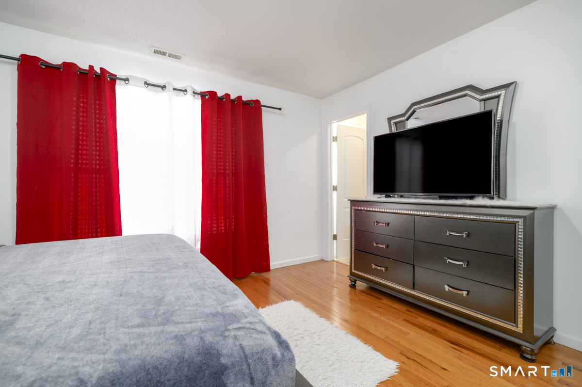 800 Seaview Avenue, Unit 8001 Bridgeport, CT 06607 - Photo 18 of 25 a living room with furniture and a flat screen tv