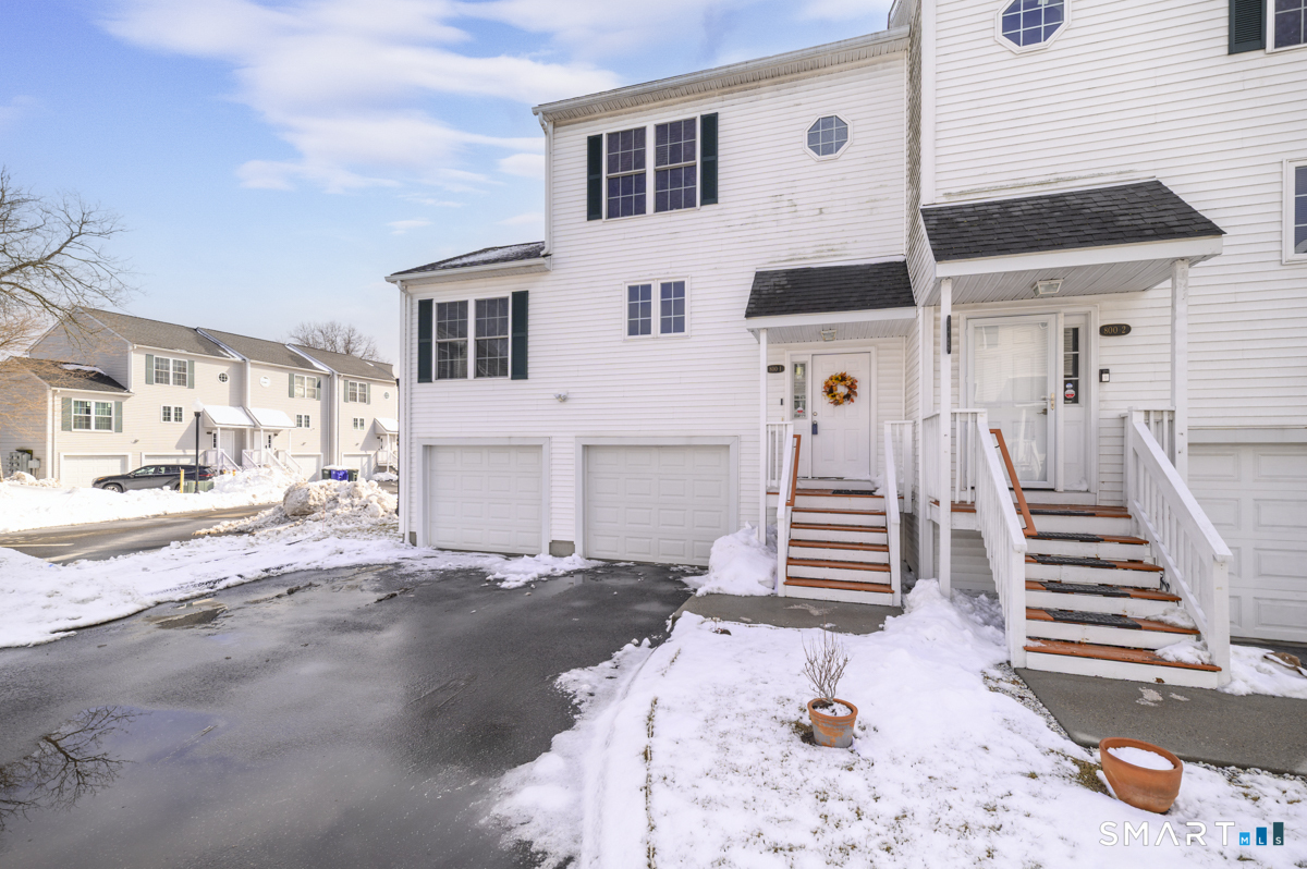 800 Seaview Avenue, Unit 8001 Bridgeport, CT 06607 - Photo 2 of 25 a front view of a house with a yard