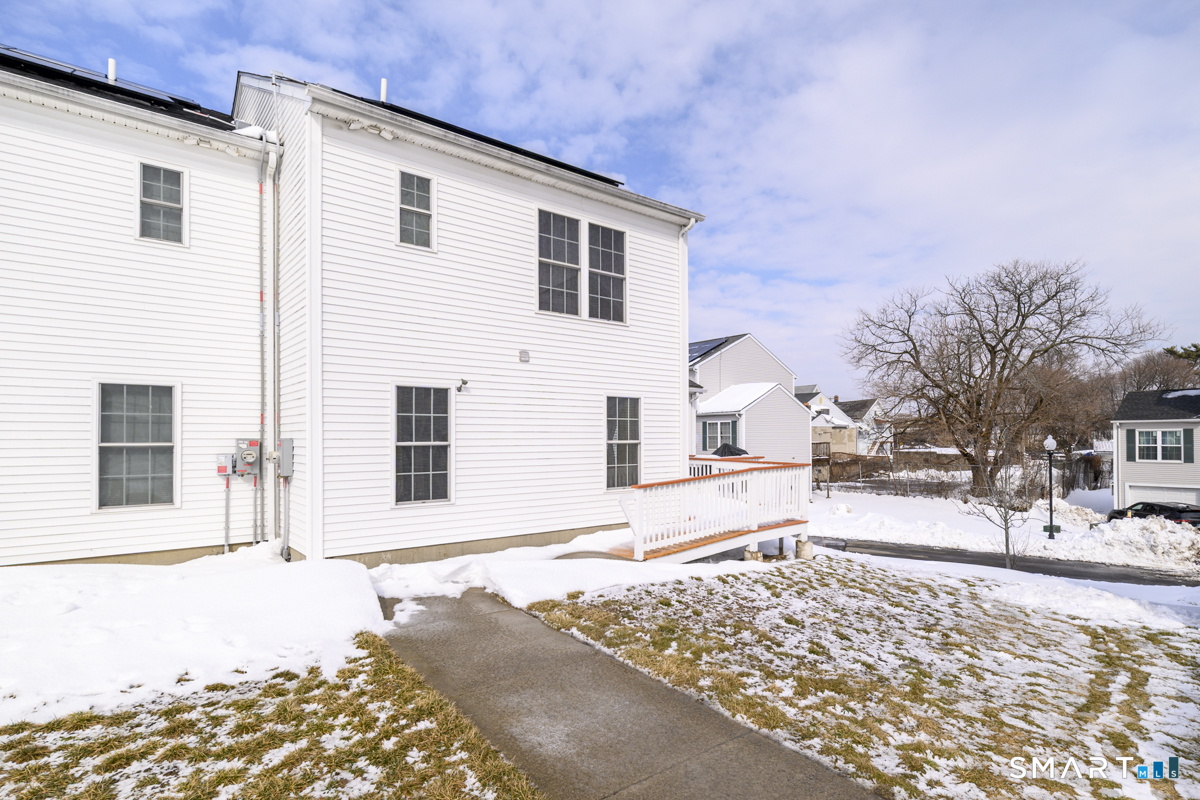 800 Seaview Avenue, Unit 8001 Bridgeport, CT 06607 - Photo 22 of 25 a front view of a house with a yard