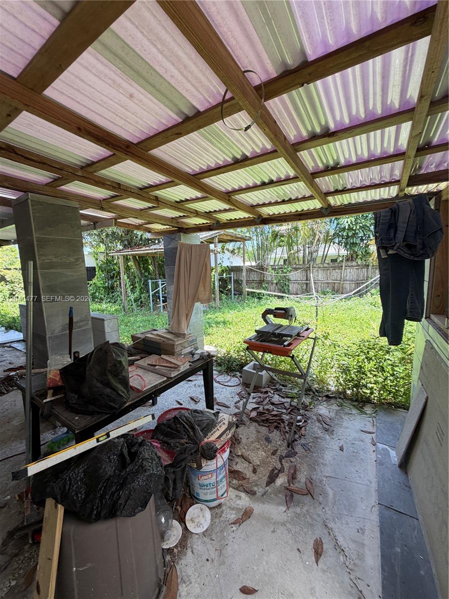 9110 Southwest 44th Street Miami, FL 33165 - Photo 9 of 18 a backyard of a house with table and chairs