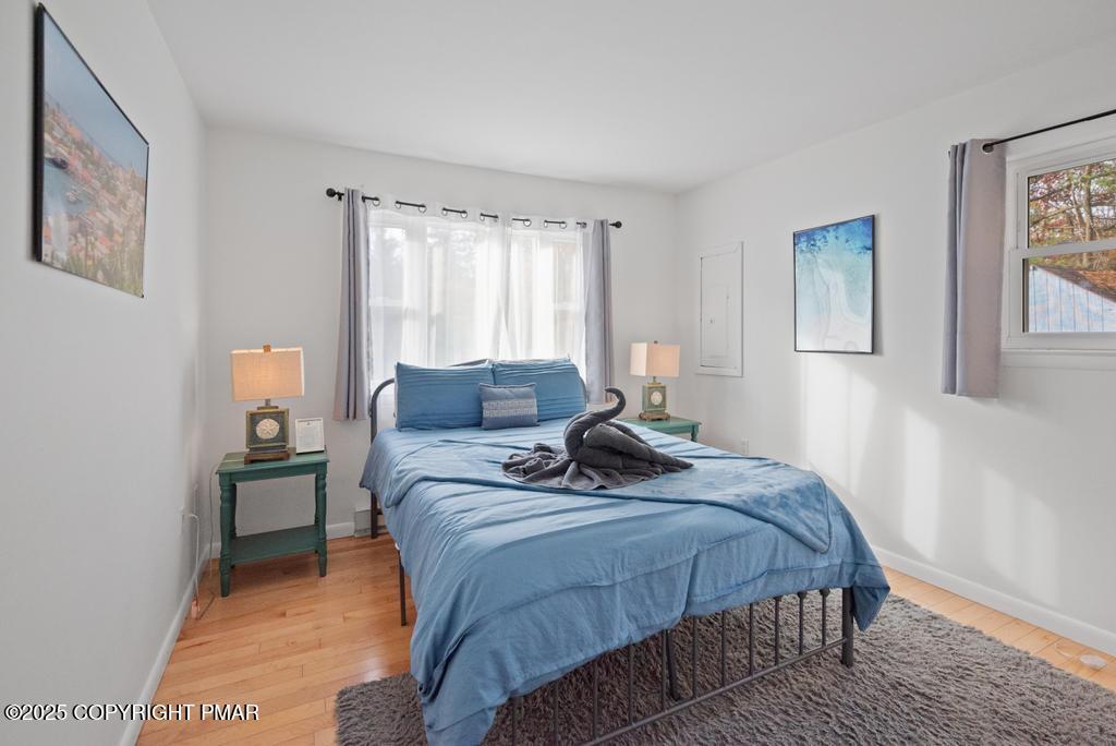 1345 Highway 715 Stroudsburg, PA 18360 - Photo 11 of 35 a bedroom with a bed and wooden floor