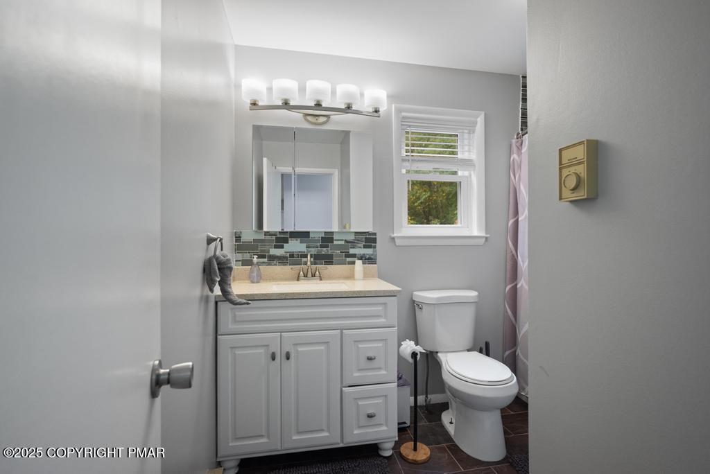 1345 Highway 715 Stroudsburg, PA 18360 - Photo 13 of 35 a bathroom with a toilet sink and mirror