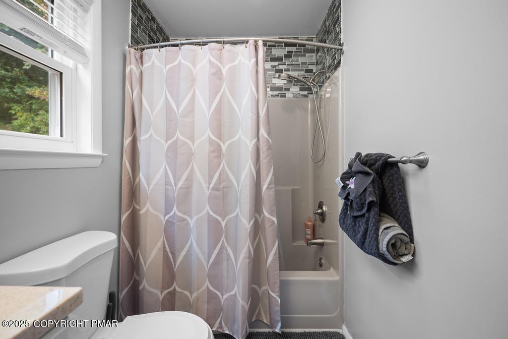 1345 Highway 715 Stroudsburg, PA 18360 - Photo 14 of 35 a bathroom with a toilet and a shower curtain