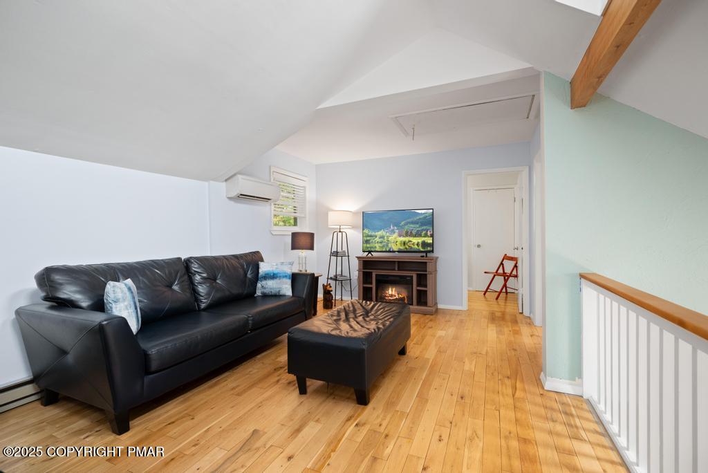1345 Highway 715 Stroudsburg, PA 18360 - Photo 15 of 35 a living room with furniture and a wooden floor