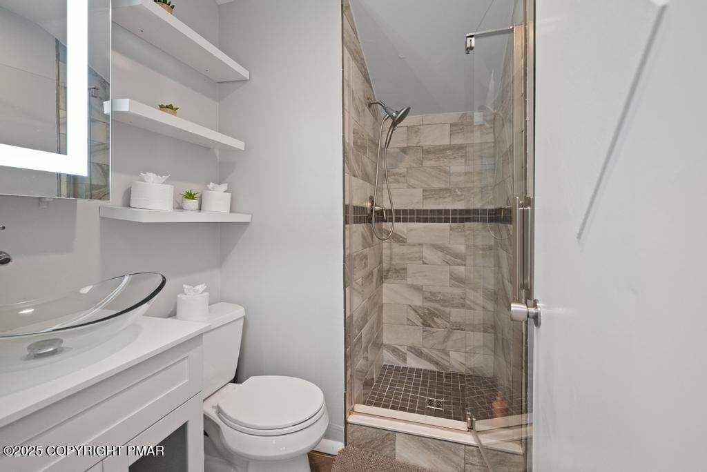 1345 Highway 715 Stroudsburg, PA 18360 - Photo 19 of 35 a bathroom with a shower a toilet and a sink