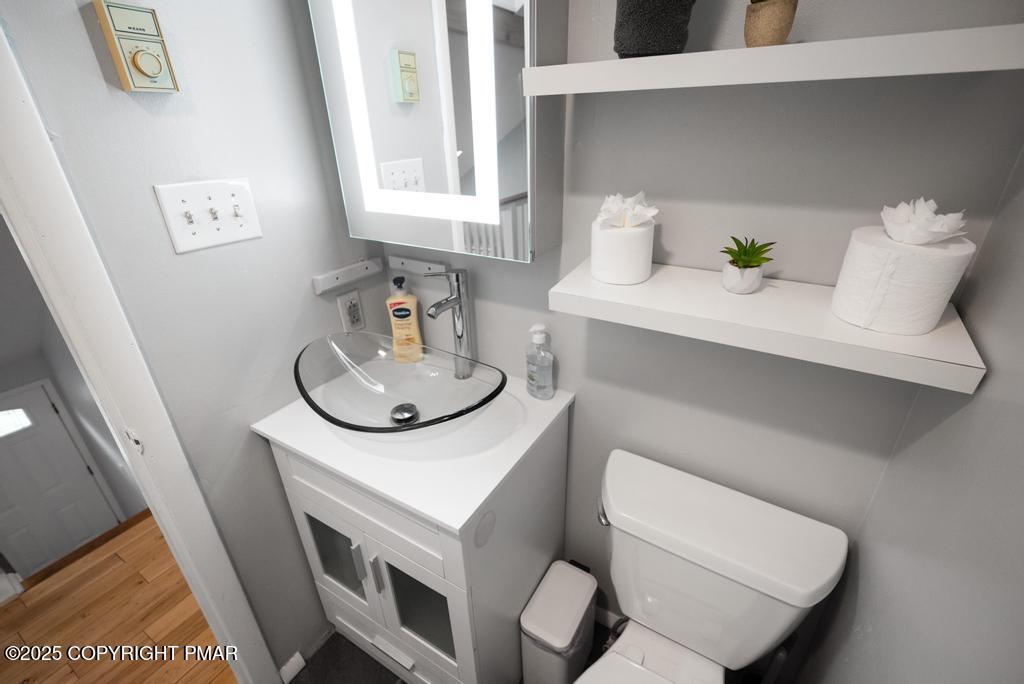 1345 Highway 715 Stroudsburg, PA 18360 - Photo 20 of 35 a bathroom with a sink toilet and mirror