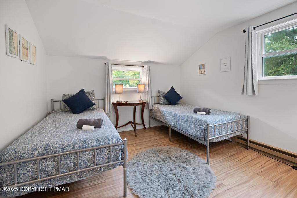 1345 Highway 715 Stroudsburg, PA 18360 - Photo 21 of 35 a bedroom with a bed and wooden floor