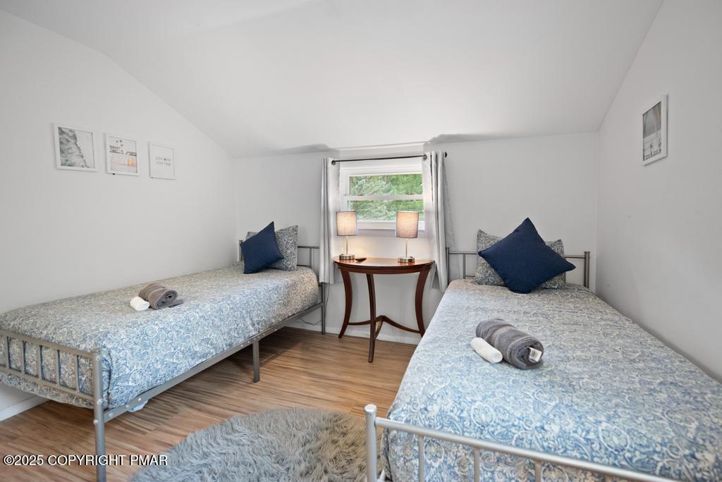 1345 Highway 715 Stroudsburg, PA 18360 - Photo 22 of 35 a bedroom with a bed and wooden floor