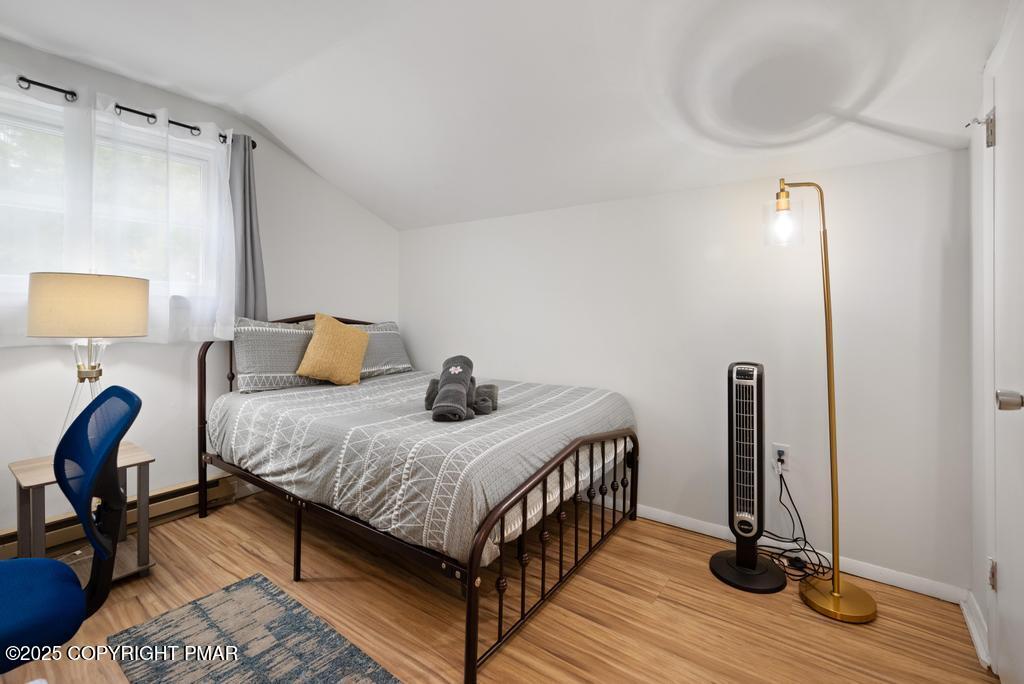 1345 Highway 715 Stroudsburg, PA 18360 - Photo 23 of 35 a bedroom with a bed and wooden floor