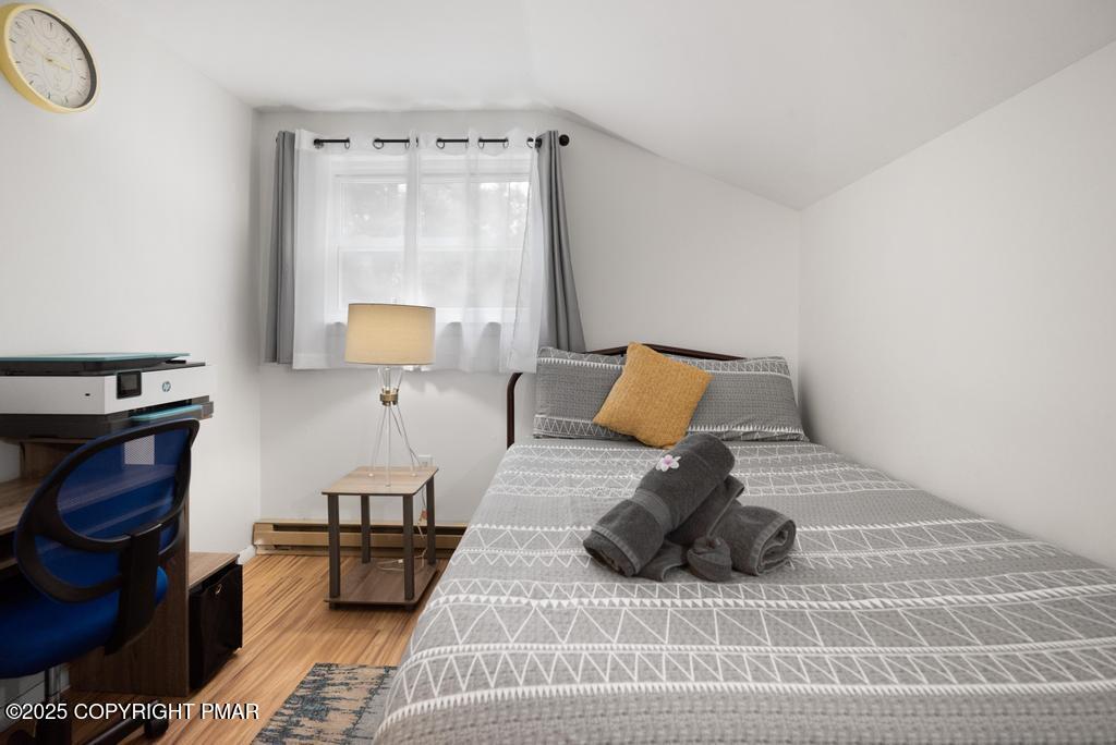 1345 Highway 715 Stroudsburg, PA 18360 - Photo 24 of 35 a bedroom with a bed and wooden floor