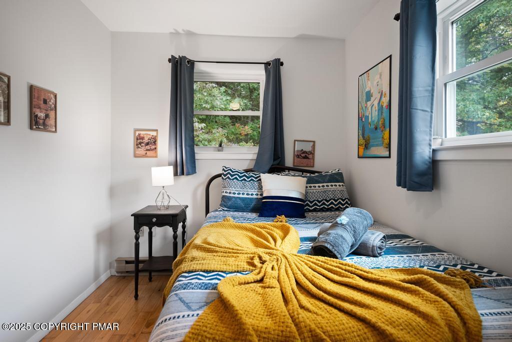 1345 Highway 715 Stroudsburg, PA 18360 - Photo 26 of 35 a bed sitting in a bedroom next to a window