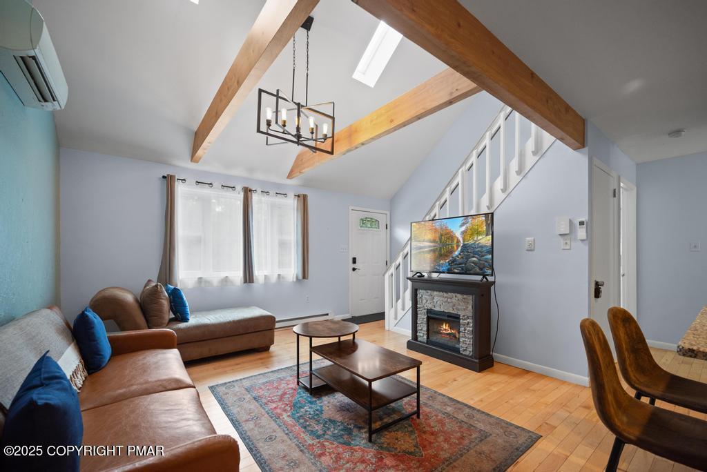 1345 Highway 715 Stroudsburg, PA 18360 - Photo 5 of 35 a living room with furniture a fireplace and a flat screen tv
