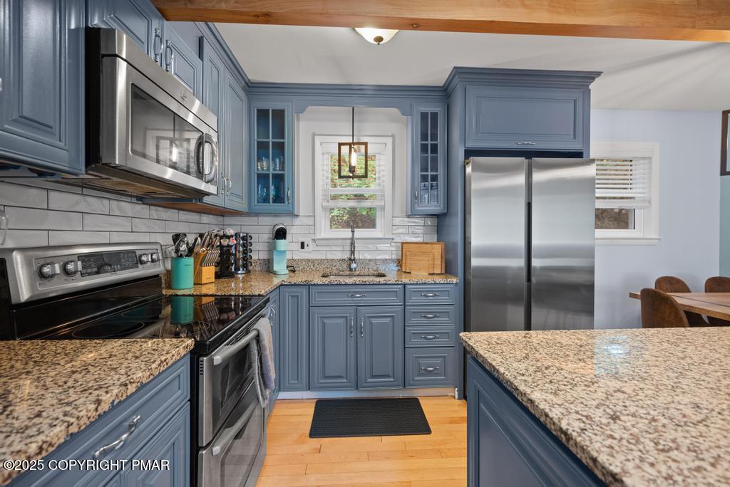 1345 Highway 715 Stroudsburg, PA 18360 - Photo 8 of 35 a kitchen with stainless steel appliances granite countertop a sink stove and refrigerator