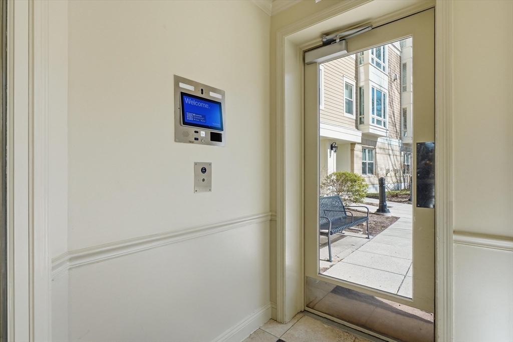 2-14 St Paul Street, Unit 403 Brookline, MA 02446 - Photo 12 of 16 a picture of a glass door with wooden floor