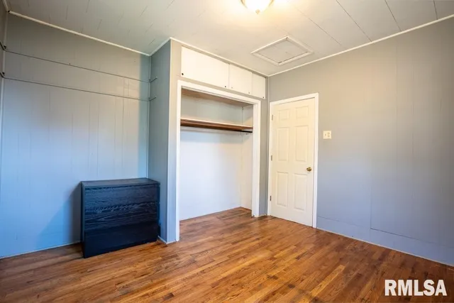 a view of room with wooden floor