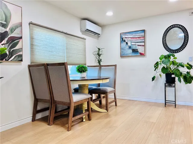 a bedroom with a bed table and a closet