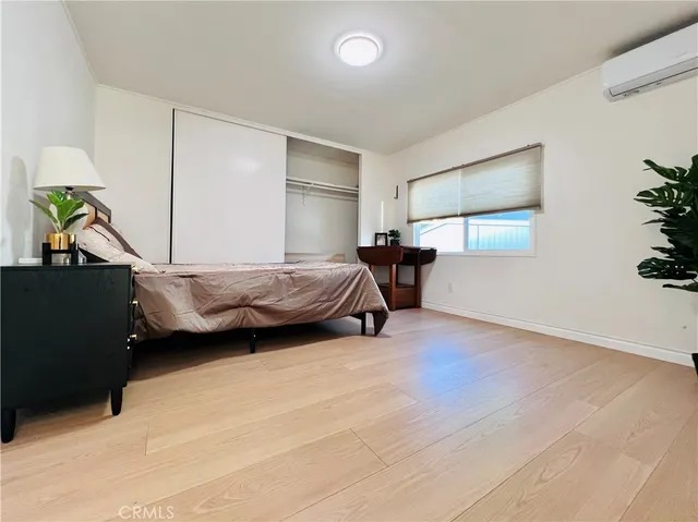 a bedroom with a bed and a table in it