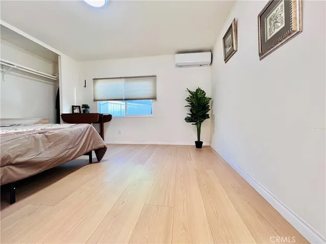 a spacious bedroom with a bed and a couch