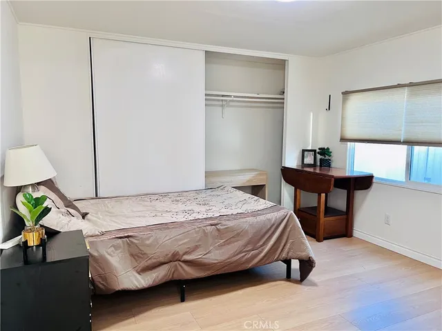 a bathroom with a granite countertop toilet sink and shower