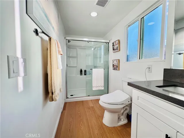 a bathroom with a toilet and a vanity