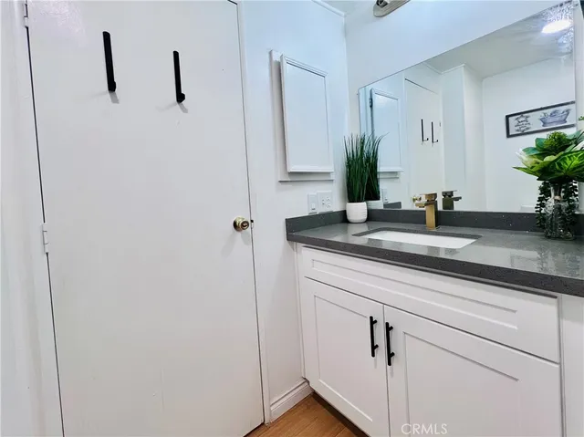 a bedroom with a bed and a dresser in it