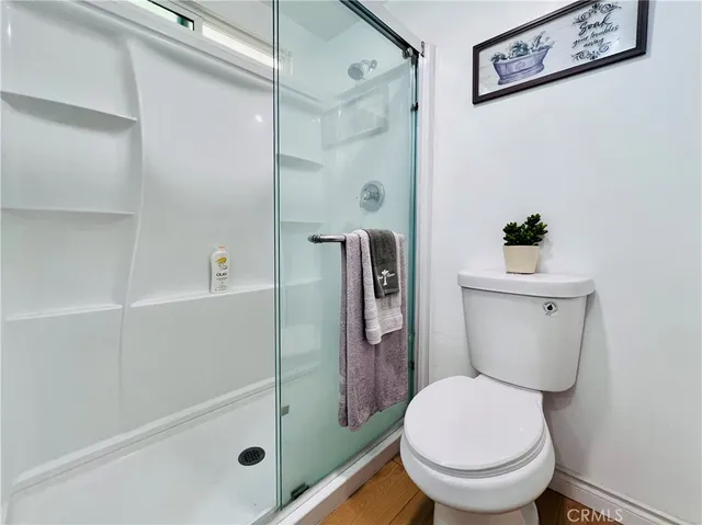 a bedroom with a bed and a cabinets