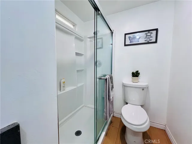 a bedroom with a bed and wall painting