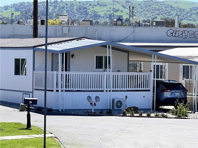 a view of a swimming pool with an outdoor seating and a garden