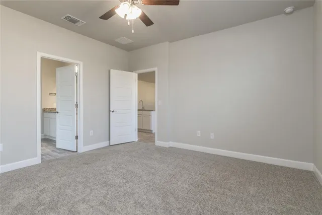 an empty room with a bathroom