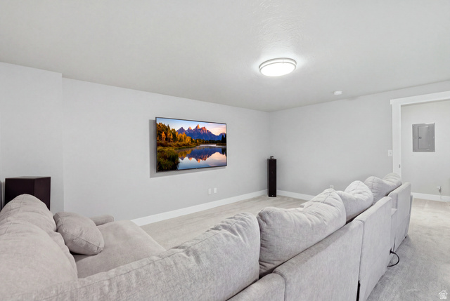 28 East Ginger Gold Road Santaquin, UT 84655 - Photo 21 of 36 Spacious room featuring light gray walls, white trim, wood-finish flooring, and a flush-mount ceiling light