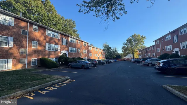 a city street lined with buildings and trees