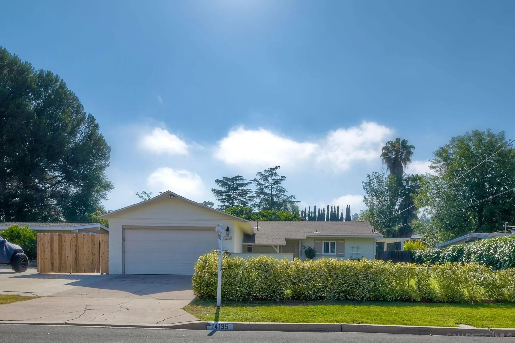 14135 Powers Road Poway, CA 92064 - Photo 1 of 35 a front view of a house with a yard
