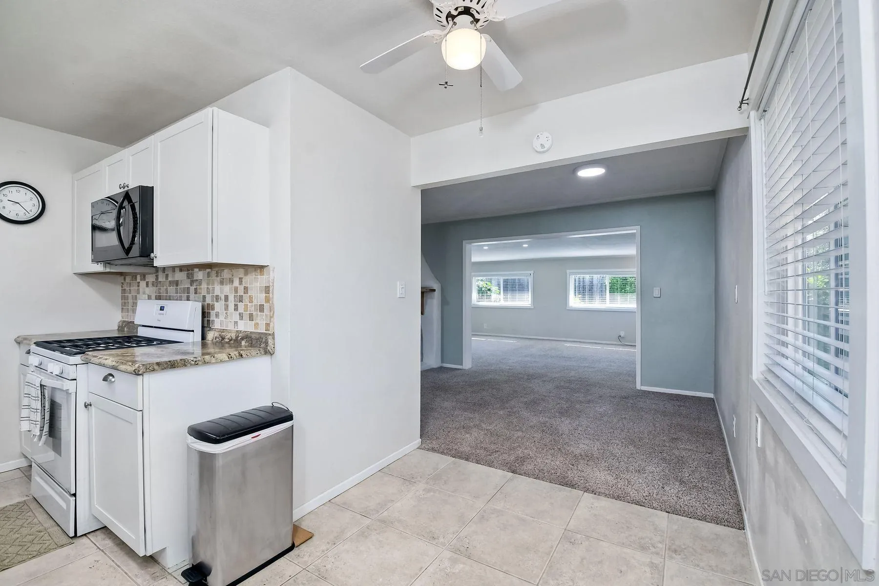 14135 Powers Road Poway, CA 92064 - Photo 11 of 35 a view of a kitchen with a stove top oven