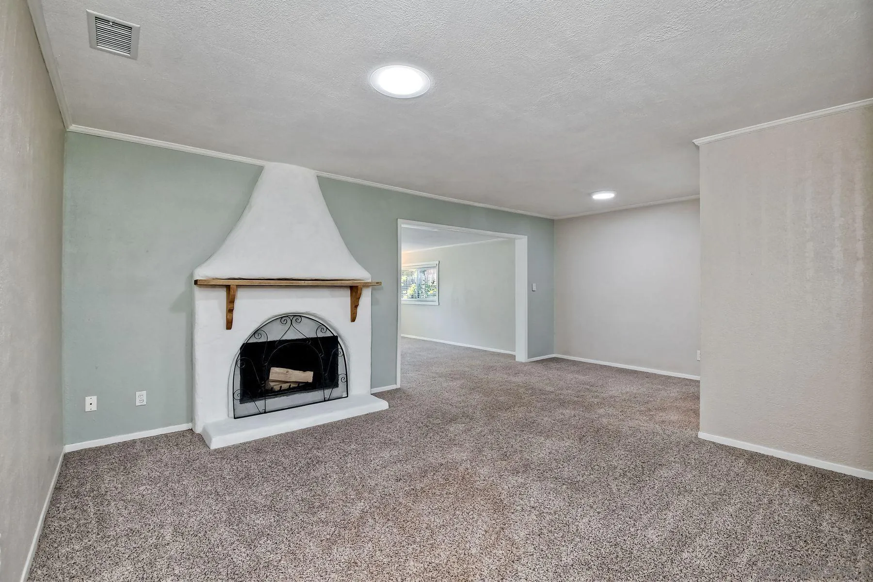14135 Powers Road Poway, CA 92064 - Photo 13 of 35 a view of an empty room with a fireplace