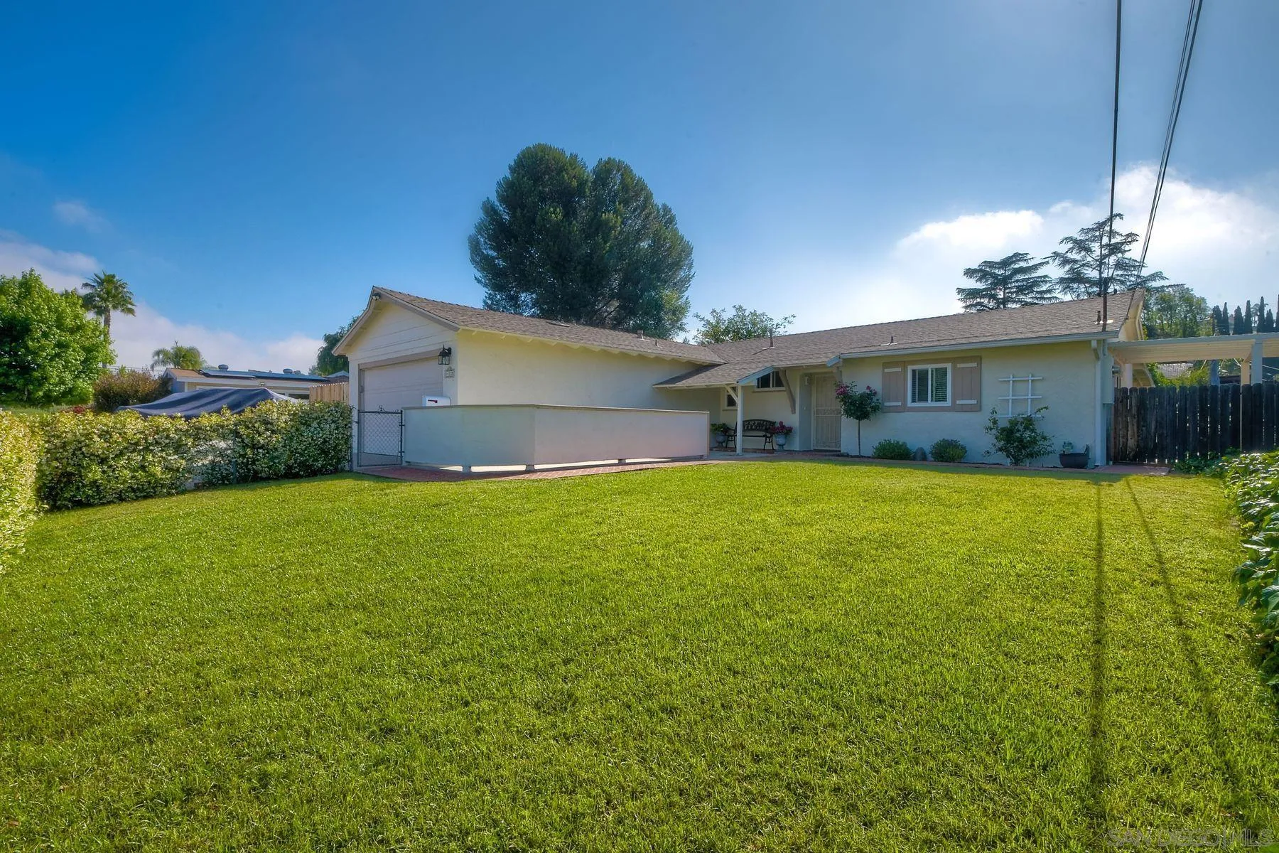 14135 Powers Road Poway, CA 92064 - Photo 3 of 35 a front view of house with yard and green space