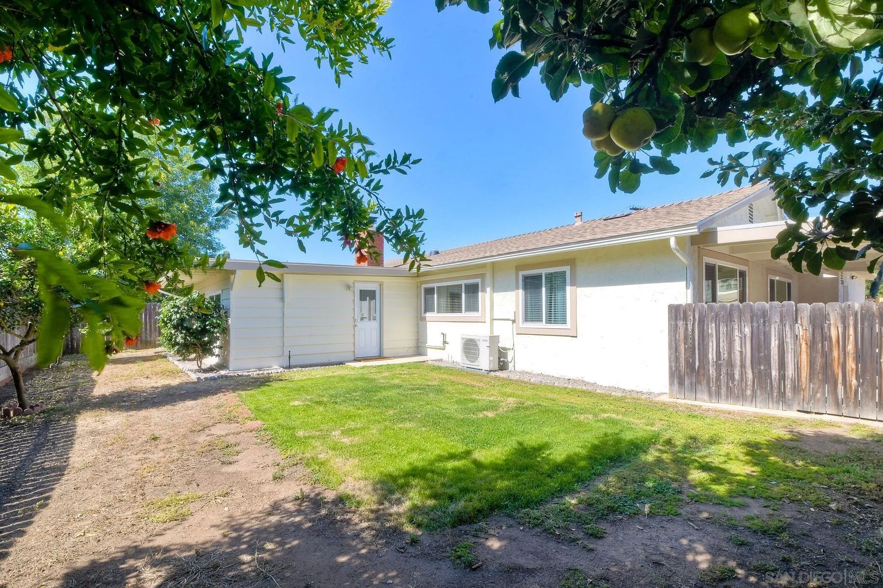 14135 Powers Road Poway, CA 92064 - Photo 31 of 35 a view of a house with a yard and a large tree