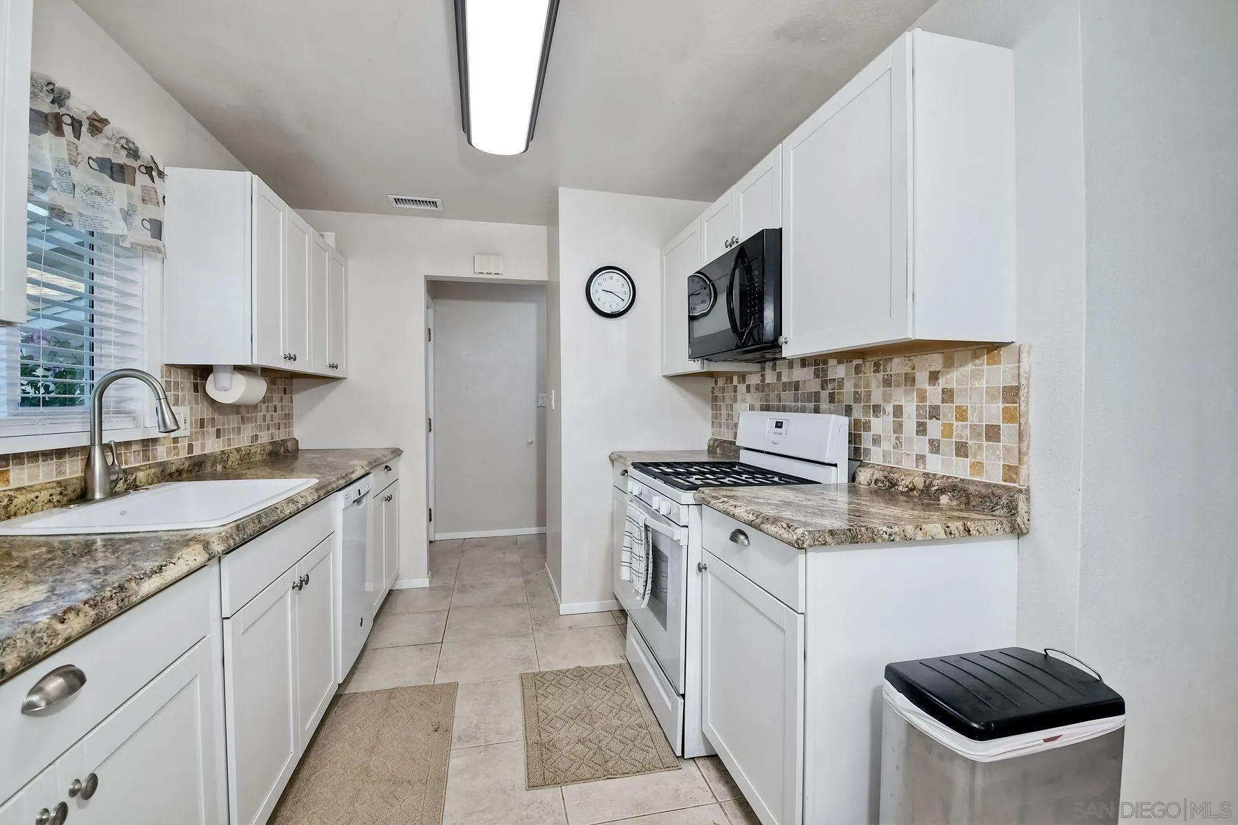 14135 Powers Road Poway, CA 92064 - Photo 8 of 35 a kitchen with stainless steel appliances granite countertop a stove and a sink
