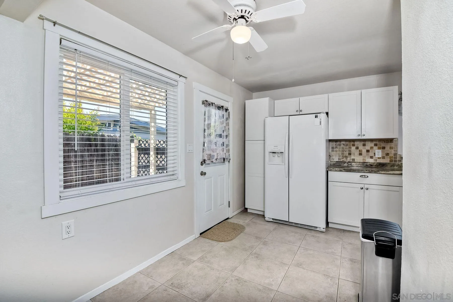 14135 Powers Road Poway, CA 92064 - Photo 9 of 35 a view of a kitchen with an entryway and kitchen view